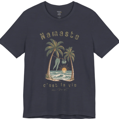 A short sleeved grunge tee with an illustrated scene of two palm trees framing a clothesline with leggings and a sports bra hanging between them, sun setting over waves, text reading "Namaste" and "c'est la vie" — Funny Yoga Shirts collection by Ramro Yoga Wear in Heather Midnight Navy.
