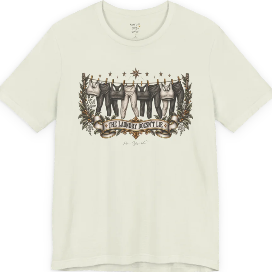 A short sleeved tee. Illustrated clothesline strung with repeating pairs of leggings and tops, framed by botanical leaf sprigs and stars. Laundry T-Shirt flat lay is a Bella+Canvas 3001 and the color is Citron.