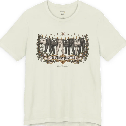 A short sleeved tee. Illustrated clothesline strung with repeating pairs of leggings and tops, framed by botanical leaf sprigs and stars. Laundry T-Shirt flat lay is a Bella+Canvas 3001 and the color is Citron.