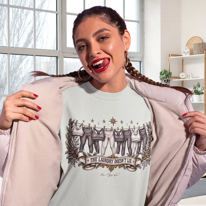 A laughing woman pulls off her jacket at the yoga studio, wearing the Laundry T-Shirt. She is showing of her new tee where the design shows her love for yoga. The Laundry T-Shirt is a Bella+Canvas 3001 and the color is Citron.