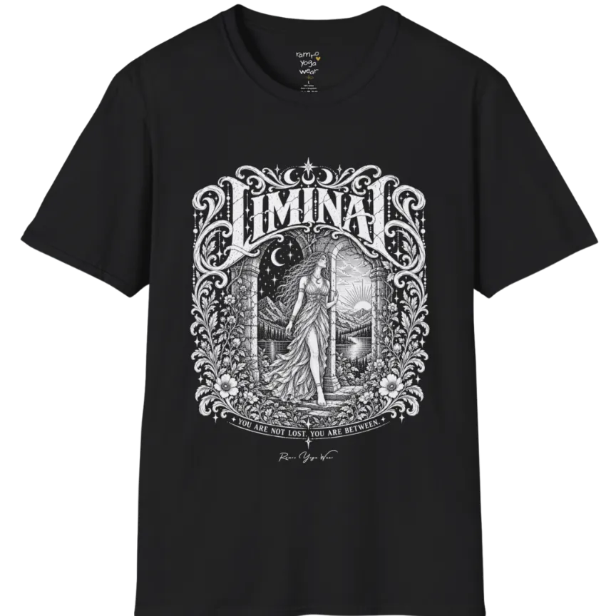 A short sleeved tee called the Liminal T-Shirt, flat lay and a soft cotton shirt. Simply says, 'You are not lost. You are between.' Design highlights ornate white LIMINAL lettering framed by flourishes and wild florals, with a robed figure standing in an arched doorway beneath a crescent moon and stars. Color is Black.