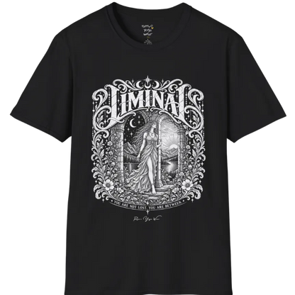 A short sleeved tee called the Liminal T-Shirt, flat lay and a soft cotton shirt. Simply says, 'You are not lost. You are between.' Design highlights ornate white LIMINAL lettering framed by flourishes and wild florals, with a robed figure standing in an arched doorway beneath a crescent moon and stars. Color is Black.