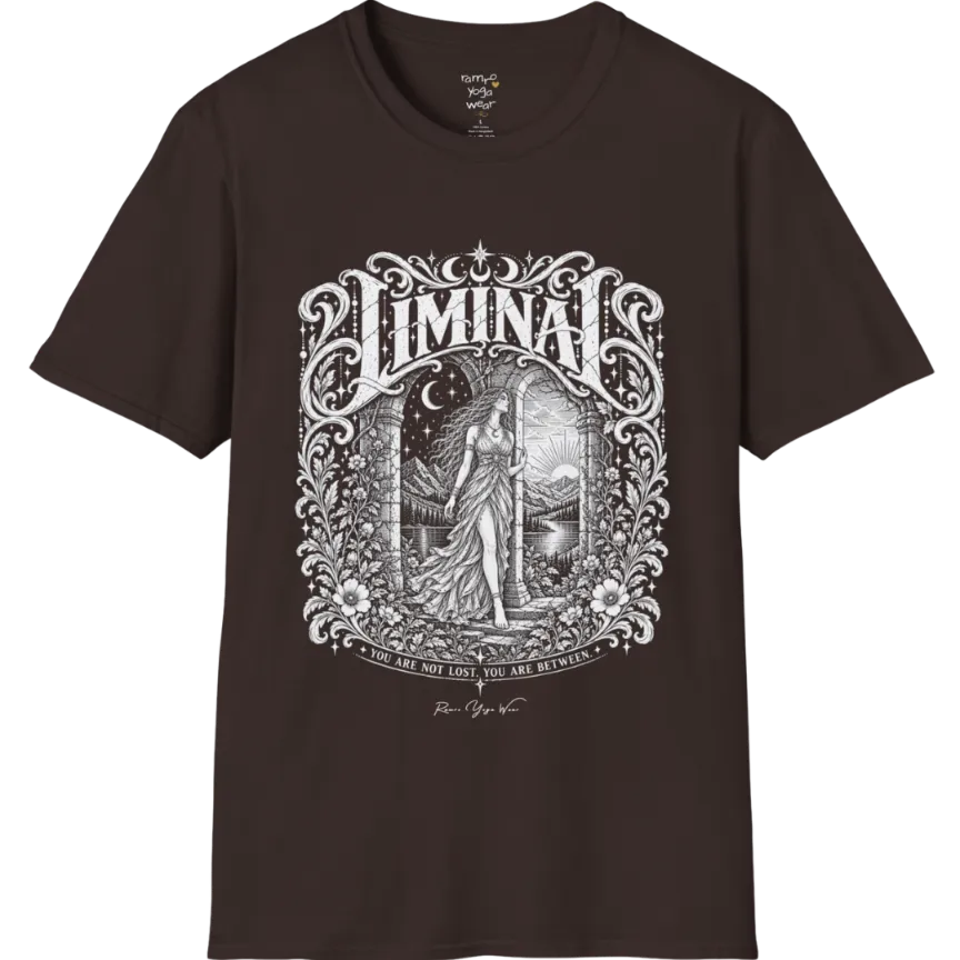 A short sleeved tee called the Liminal T-Shirt, flat lay and a soft cotton shirt. Simply says, 'You are not lost. You are between.' Design highlights ornate white LIMINAL lettering framed by flourishes and wild florals, with a robed figure standing in an arched doorway beneath a crescent moon and stars. Color is Dark Chocolate.