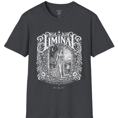 A short sleeved tee called the Liminal T-Shirt, flat lay and a soft cotton shirt. Simply says, 'You are not lost. You are between.' Design highlights ornate white LIMINAL lettering framed by flourishes and wild florals, with a robed figure standing in an arched doorway beneath a crescent moon and stars. Color is Dark Heather Grey.
