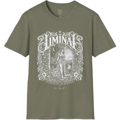 A short sleeved tee called the Liminal T-Shirt, flat lay and a soft cotton shirt. Simply says, 'You are not lost. You are between.' Design highlights ornate white LIMINAL lettering framed by flourishes and wild florals, with a robed figure standing in an arched doorway beneath a crescent moon and stars. Color is Heather Military Green.