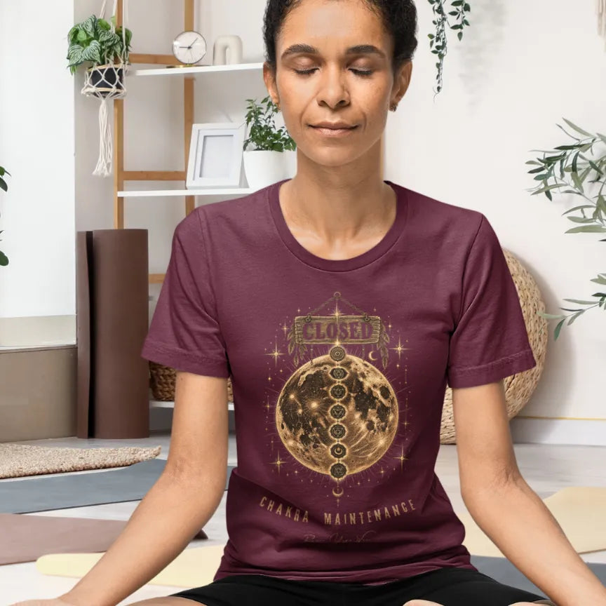 Person wearing the Maintenance T-Shirt in Heather Cardinal, seated indoors with eyes closed, meditating — Funny Yoga Shirts collection by Ramro Yoga Wear.