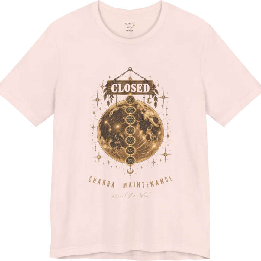 A grunge tee with a "Closed" sign hanging above a full moon, seven chakra symbols stacked down its surface, text reading "Chakra Maintenance" — Funny Yoga Shirts collection by Ramro Yoga Wear in Soft Pink.