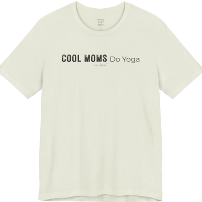 A short sleeved tee called the Moms T-Shirt, flat lay and a soft cotton shirt. Simply says, Cool Moms Do Yoga. Design highlights bold distressed block lettering for Cool Moms beside lighter thin lettering for Do Yoga, with a small script signature underneath. Color is Citron.