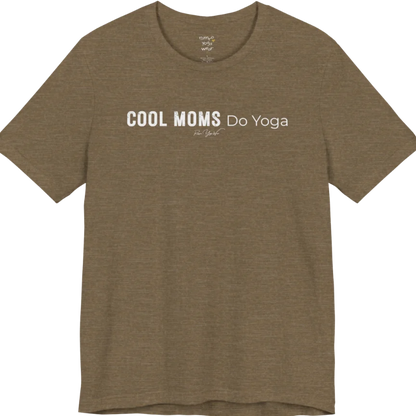 A short sleeved tee called the Moms T-Shirt, flat lay and a soft cotton shirt. Simply says, Cool Moms Do Yoga. Design highlights bold distressed block lettering for Cool Moms beside lighter thin lettering for Do Yoga, with a small script signature underneath. Color is Heather Olive.