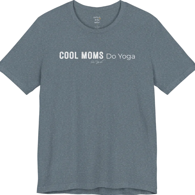 A short sleeved tee called the Moms T-Shirt, flat lay and a soft cotton shirt. Simply says, Cool Moms Do Yoga. Design highlights bold distressed block lettering for Cool Moms beside lighter thin lettering for Do Yoga, with a small script signature underneath. Color is Heather Slate.