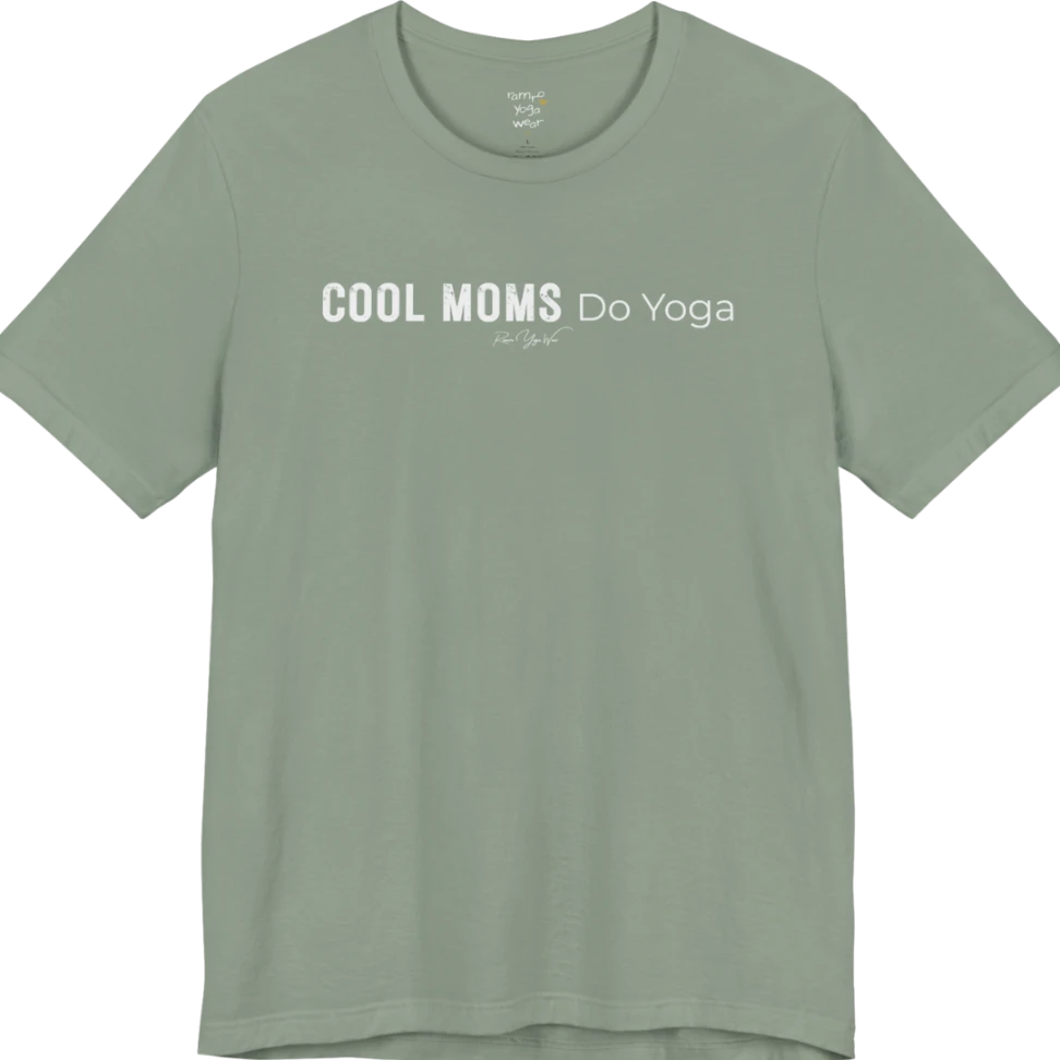 A short sleeved tee called the Moms T-Shirt, flat lay and a soft cotton shirt. Simply says, Cool Moms Do Yoga. Design highlights bold distressed block lettering for Cool Moms beside lighter thin lettering for Do Yoga, with a small script signature underneath. Color is Sage.