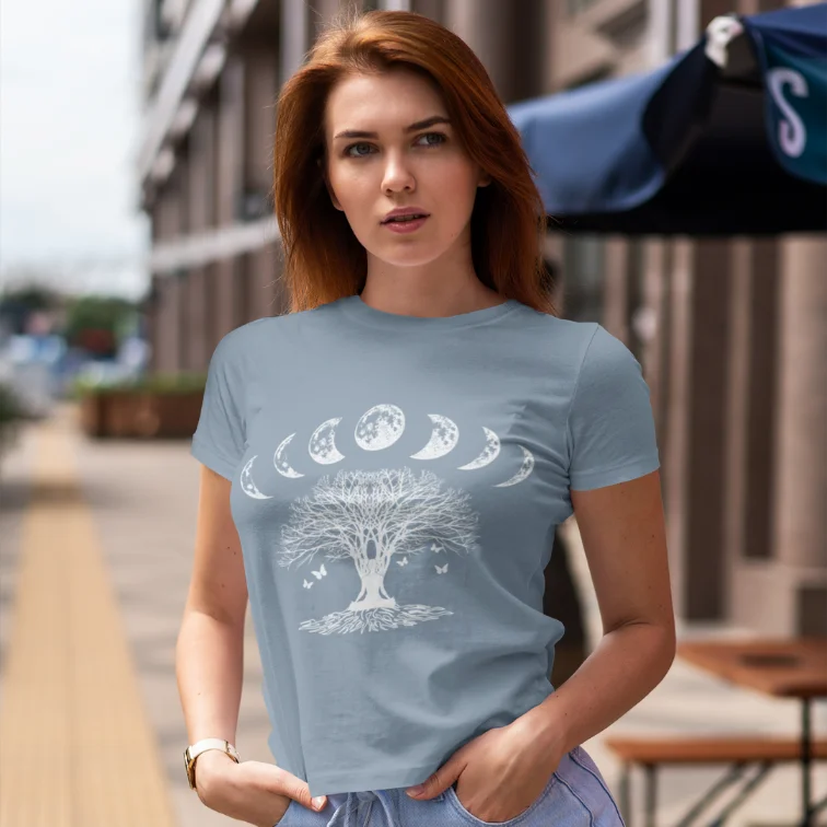 Woman wearing Moon Forest Stone Blue T-Shirt outdoors on a city street — The Vault collection by Ramro Yoga Wear