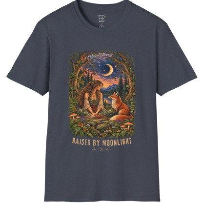 A short sleeved tee called the Moonlight T-Shirt, flat lay and a Gildan 64000 shirt. Simply says, Raised By Moonlight. Design highlights a woman sitting cross-legged in a moonlit forest clearing with a fox beside her, surrounded by mushrooms and ferns, in a full-color painted illustration style. Color is Heather Navy.