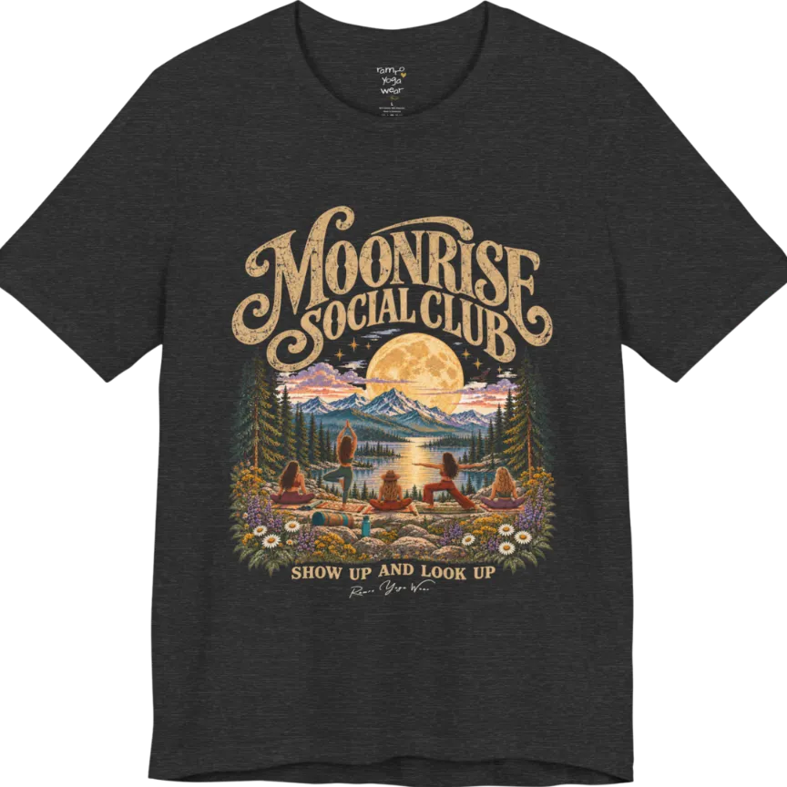 A short sleeved tee called the Moonrise T-Shirt, flat lay and a Bella+Canvas 3001. Simply says, Moonrise Social Club. Show Up And Look Up. Design highlights five women seen from behind practicing yoga on a rocky lakeside shelf, one in tree pose, one in warrior pose and three seated, beneath a glowing full moon rising over snow-capped mountains, framed by pine trees and wildflowers. Color is Dark Heather Grey.