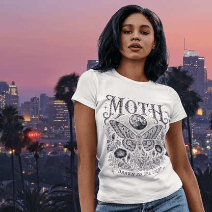 Ramro Yoga Wear Moth tee — lifestyle shot, city sunset, moth moon botanical vintage engraving