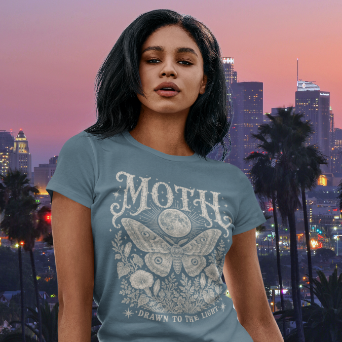 Ramro Yoga Wear Moth tee — lifestyle shot, city sunset, moth moon botanical vintage engraving
