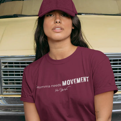 Person wearing the Movement T-Shirt in Heather Cardinal, wearing a cap and standing outdoors near a vintage car — Funny Yoga Shirts collection by Ramro Yoga Wear.