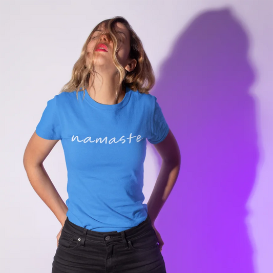 Namaste T-Shirt worn in a bold, fashion-forward setting with vibrant lighting. Statement yoga tee with modern, confident energy.