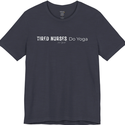 A short sleeved tee called the Nurses T-Shirt, flat lay and a soft cotton blend shirt. Simply says, Tired Nurses Do Yoga. Design highlights bold distressed block lettering for TIRED NURSES beside thin lettering for Do Yoga, with a small script signature underneath. Color is Heather Midnight Navy.