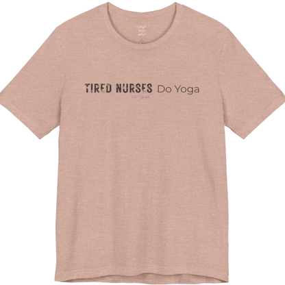 A short sleeved tee called the Nurses T-Shirt, flat lay and a soft cotton blend shirt. Simply says, Tired Nurses Do Yoga. Design highlights bold distressed block lettering for TIRED NURSES beside thin lettering for Do Yoga, with a small script signature underneath. Color is Heather Prism Peach.