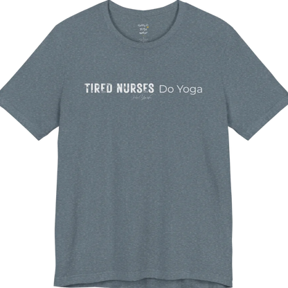 A short sleeved tee called the Nurses T-Shirt, flat lay and a soft cotton blend shirt. Simply says, Tired Nurses Do Yoga. Design highlights bold distressed block lettering for TIRED NURSES beside thin lettering for Do Yoga, with a small script signature underneath. Color is Heather Slate.