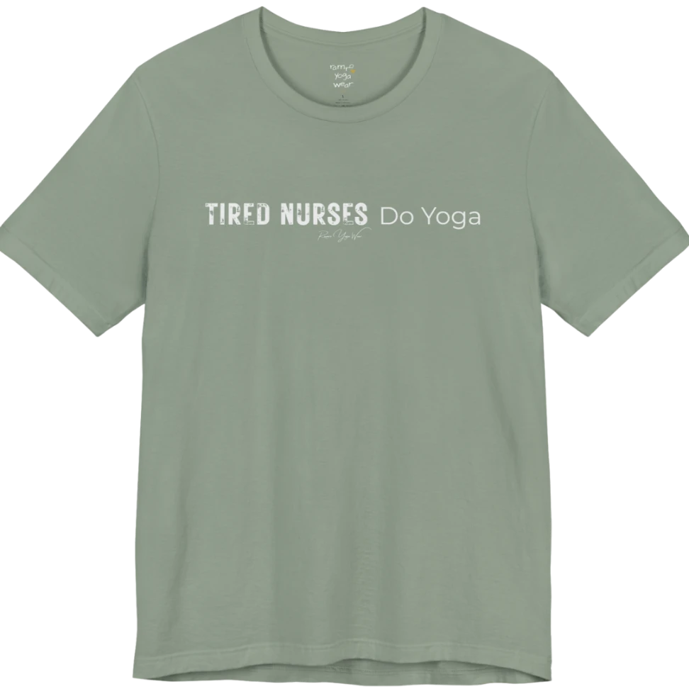 A short sleeved tee called the Nurses T-Shirt, flat lay and a soft cotton blend shirt. Simply says, Tired Nurses Do Yoga. Design highlights bold distressed block lettering for TIRED NURSES beside thin lettering for Do Yoga, with a small script signature underneath. Color is Sage.