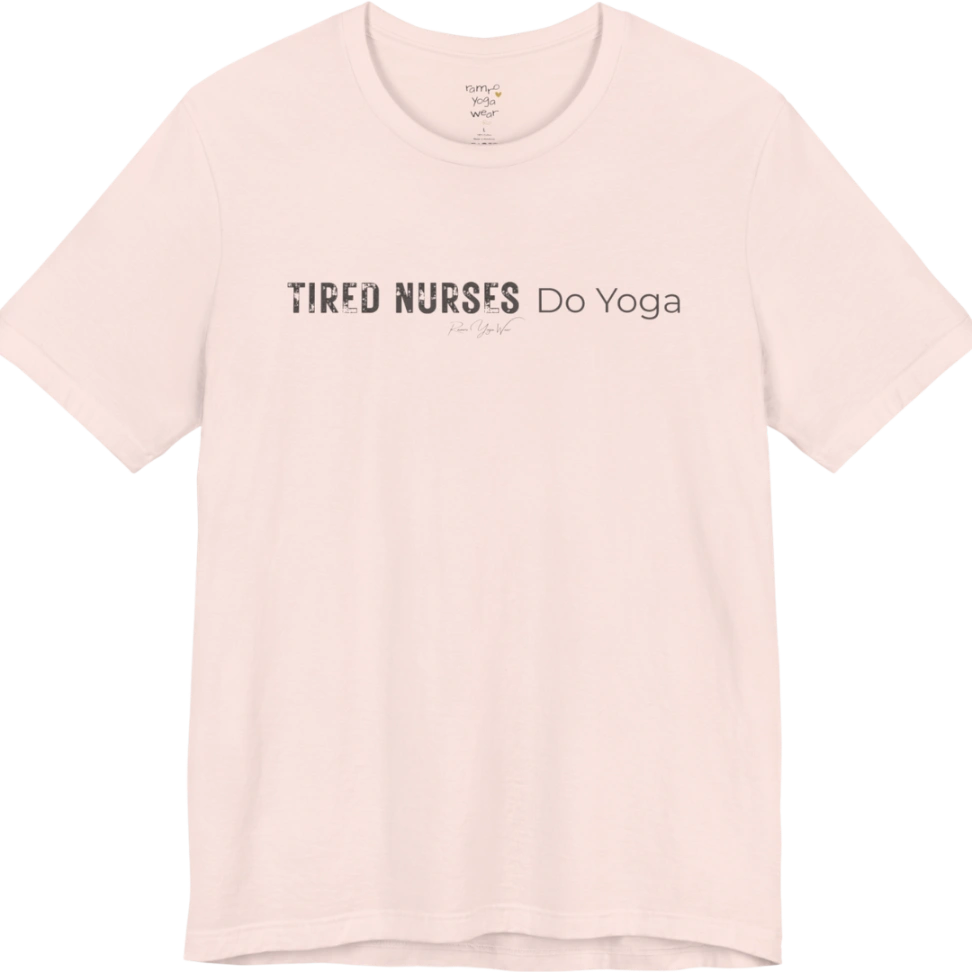 A short sleeved tee called the Nurses T-Shirt, flat lay and a soft cotton blend shirt. Simply says, Tired Nurses Do Yoga. Design highlights bold distressed block lettering for TIRED NURSES beside thin lettering for Do Yoga, with a small script signature underneath. Color is Soft Pink.