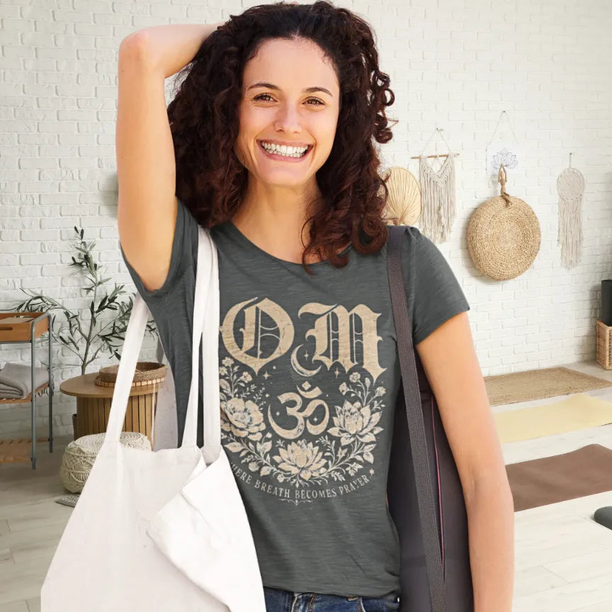 Ramro Yoga Wear Om tee in Dark Heather Grey — gothic OM symbol and lotus design, ready to start her yoga practice. 