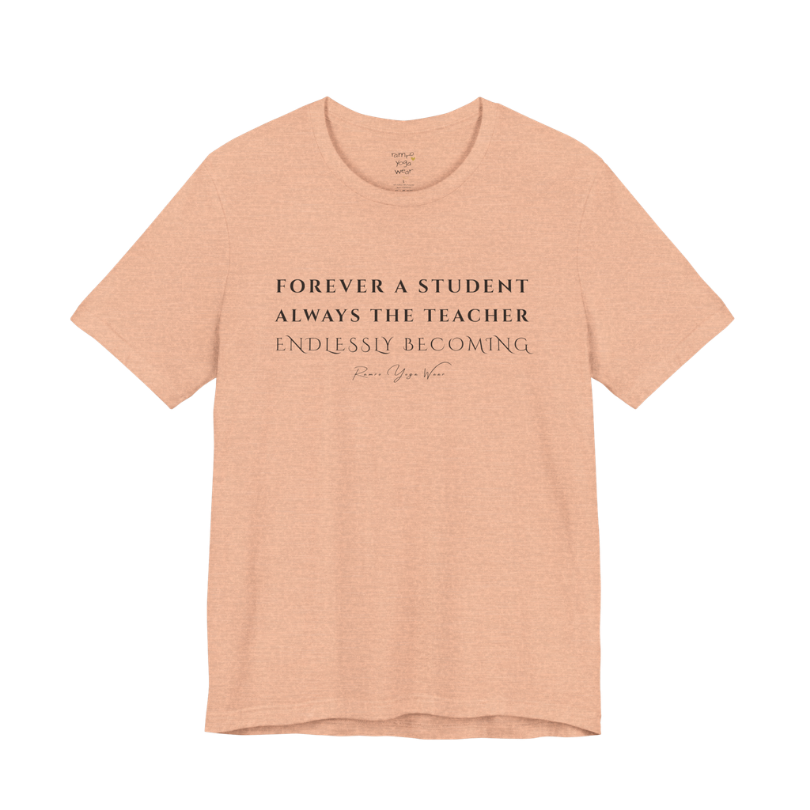 FOREVER A STUDENT ALWAYS THE TEACHER ENDLESSLY BECOMING yoga teacher gift tee flat lay in Heather Peach — Yoga Teacher Gifts collection by Ramro Yoga Wear