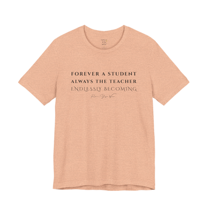 FOREVER A STUDENT ALWAYS THE TEACHER ENDLESSLY BECOMING yoga teacher gift tee flat lay in Heather Peach — Yoga Teacher Gifts collection by Ramro Yoga Wear