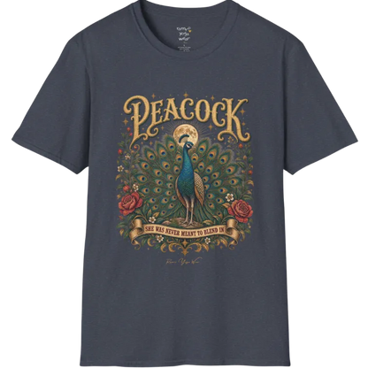 A short sleeved tee, illustration of a Peacock with full tail fan beneath a glowing moon, full-color vintage poster art with "She Was Never Meant To Blend In" banner — Wild Animals collection by Ramro Yoga Wear in Heather Navy.