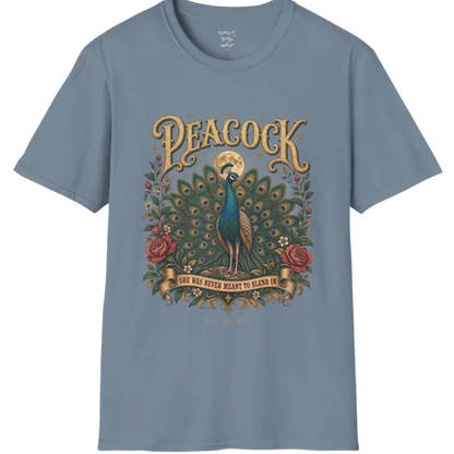 A short sleeved tee, illustration of a Peacock with full tail fan beneath a glowing moon, full-color vintage poster art with "She Was Never Meant To Blend In" banner — Wild Animals collection by Ramro Yoga Wear in Stone Blue.