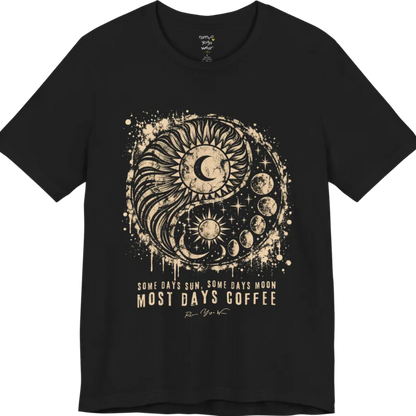 A short sleeved tee called the Phases T-Shirt, flat lay and a Bella+Canvas 3001 shirt. Simply says, Some Days Sun, Some Days Moon, Most Days Coffee. Design highlights a grunge yin yang made of a radiating sun and a tail of moon phases, with stars and ink splatter. Color is Black.
