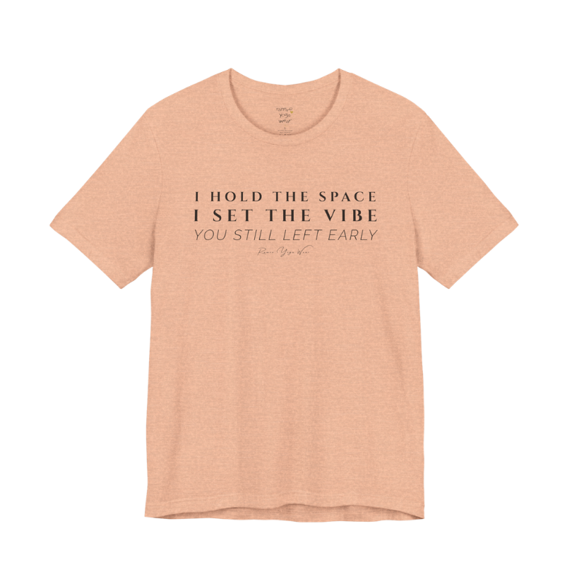 I HOLD THE SPACE I SET THE VIBE YOU STILL LEFT EARLY yoga teacher gift tee flat lay in Heather Peach — Yoga Teacher Gifts collection by Ramro Yoga Wear