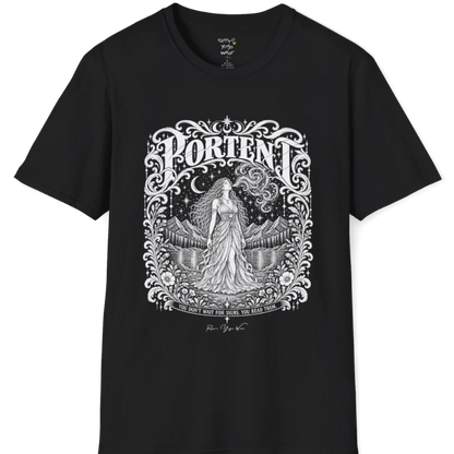 A short sleeved tee called the Portent T-Shirt, flat lay and a soft cotton shirt. Simply says, You don't wait for signs. You read them. Design highlights an ornate engraved frame of florals and filigree around a long-haired figure in a flowing gown standing before mountains and still water, with a crescent moon, stars and swirling smoke above and Portent in decorative lettering across the top. Color is Black.