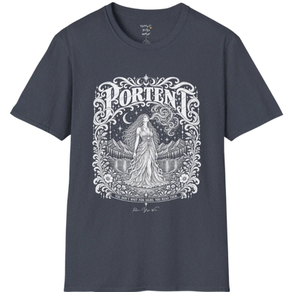 A short sleeved tee called the Portent T-Shirt, flat lay and a soft cotton shirt. Simply says, You don't wait for signs. You read them. Design highlights an ornate engraved frame of florals and filigree around a long-haired figure in a flowing gown standing before mountains and still water, with a crescent moon, stars and swirling smoke above and Portent in decorative lettering across the top. Color is Heather Navy.