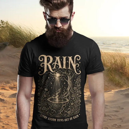 Person wearing Rain tee in black, a sacred yoga shirt on sand dunes at the beach — Sacred Thread collection by Ramro Yoga Wear