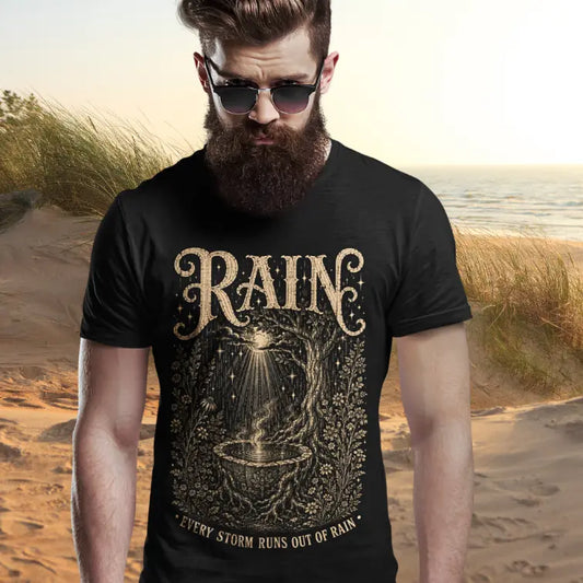 Person wearing Rain tee in black, a sacred yoga shirt on sand dunes at the beach — Sacred Thread collection by Ramro Yoga Wear