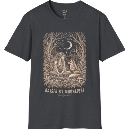 A short sleeved tee called the Raised T-Shirt, flat lay and a Gildan 64000 shirt. Simply says, Raised By Moonlight. Design highlights a woman sitting cross-legged in a moonlit forest clearing with a fox beside her, surrounded by mushrooms and ferns, in fine sepia linework. Color is Dark Heather Grey.