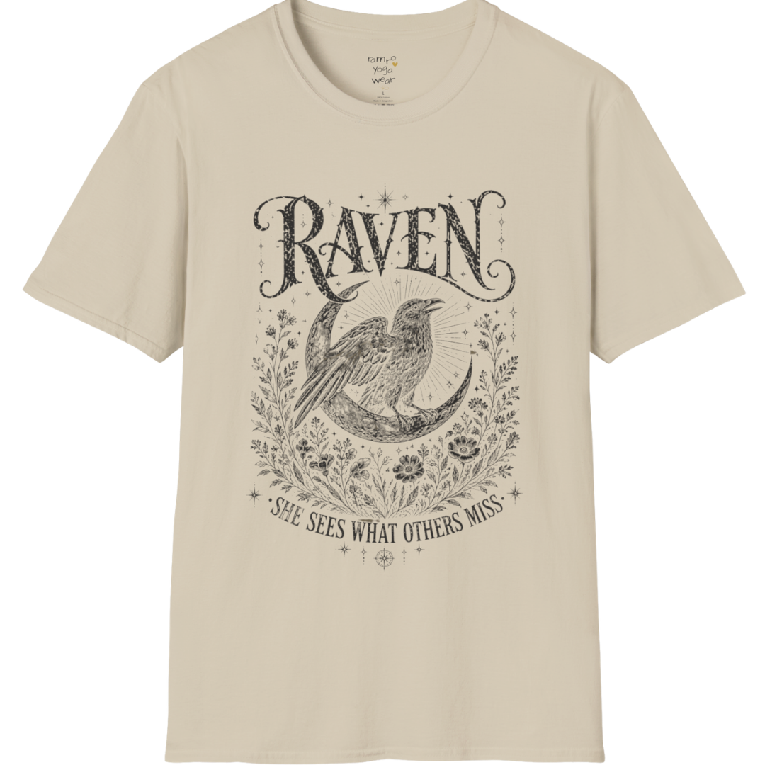 Sand Raven T-Shirt featuring spiritual raven artwork with botanical detailing, moon symbolism, and antique-inspired engraving textures