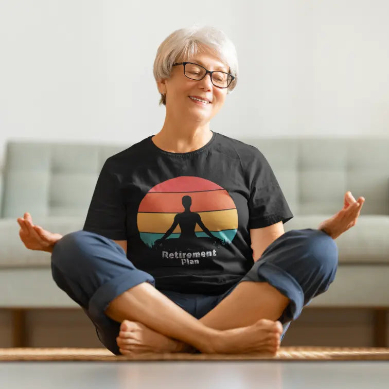 Retirement T-Shirt featuring relaxed yoga moment indoors. Soft, mindful tee styled for calm and comfort.