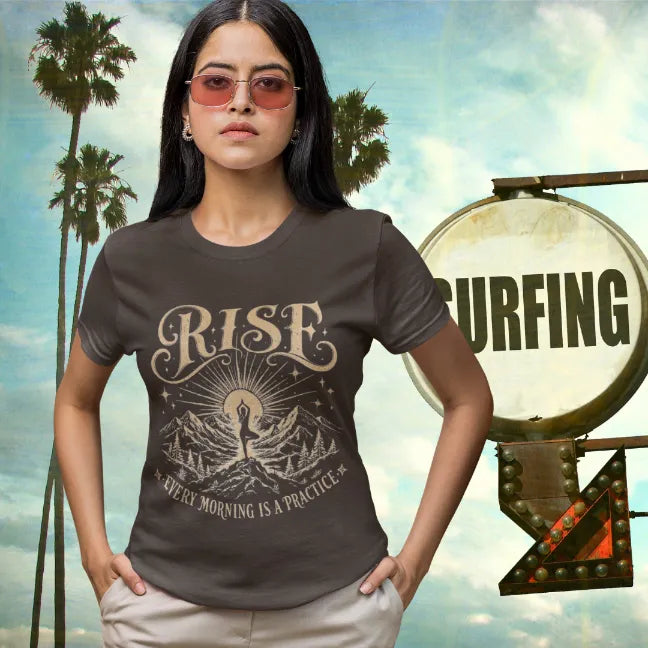Woman wearing Dark Chocolate Rise T-Shirt in retro California-inspired outdoor lifestyle setting with mindful streetwear aesthetic.