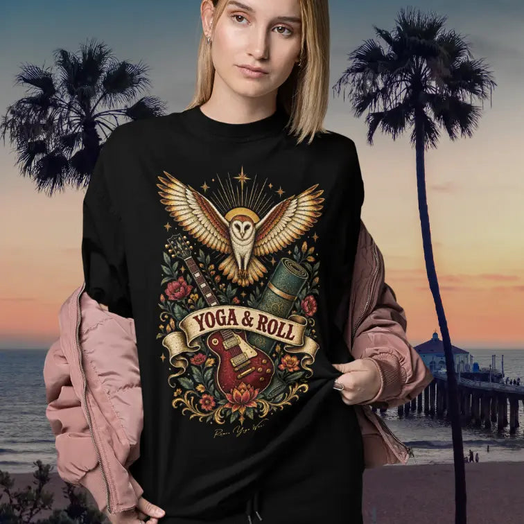 Person wearing Roll black tee, standing on the beach at the pier at sunset — Wild Animals collection by Ramro Yoga Wear