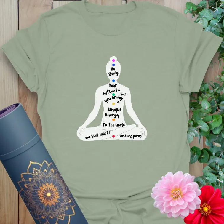 Green unisex tee with peaceful yoga figure and "unique energy" affirmation