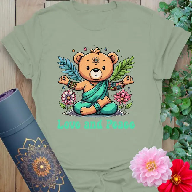 Sage green yoga t-shirt with whimsical bear and peace-themed design