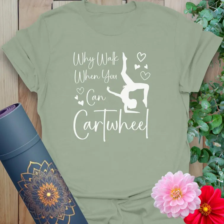 Sage green tee with movement quote and happy cartwheel pose graphic