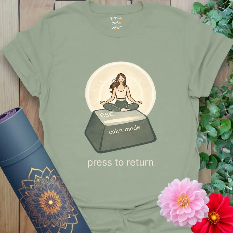 Sage Esc T-Shirt featuring a peaceful meditation illustration on an escape key. Soft yoga lifestyle graphic shirt.