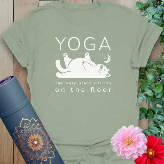 Calm sage green yoga t-shirt featuring cute cat and yoga humor design celebrating relaxation and mindful movement.
