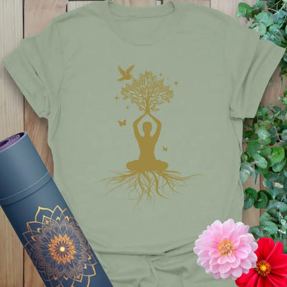 Calm sage green yoga t-shirt featuring sacred tree of life and yogi design symbolizing grounded mindfulness and spiritual growth.