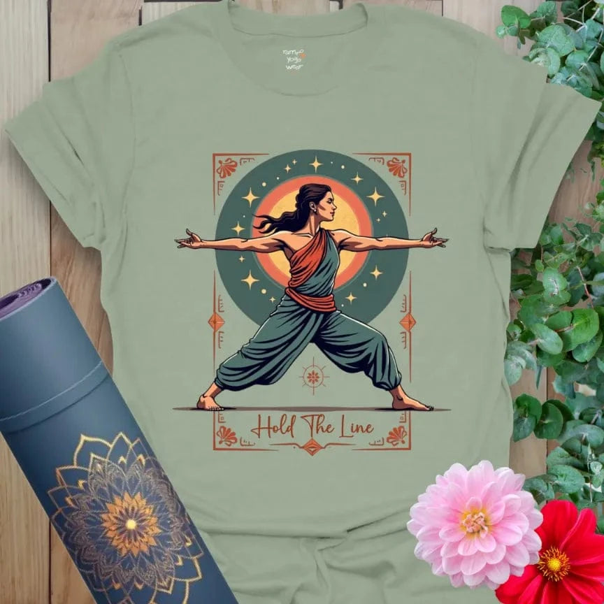 Calm sage green yoga t-shirt featuring strong Warrior II figure and cosmic background for soulful strength and grounded resilience.